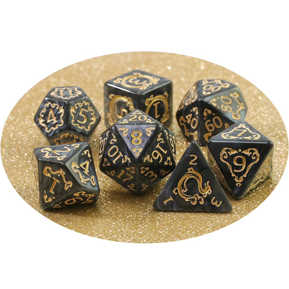 A set of dragon-inspired polyhedral dice including d10, d12, and d20 shapes on a gold background.
