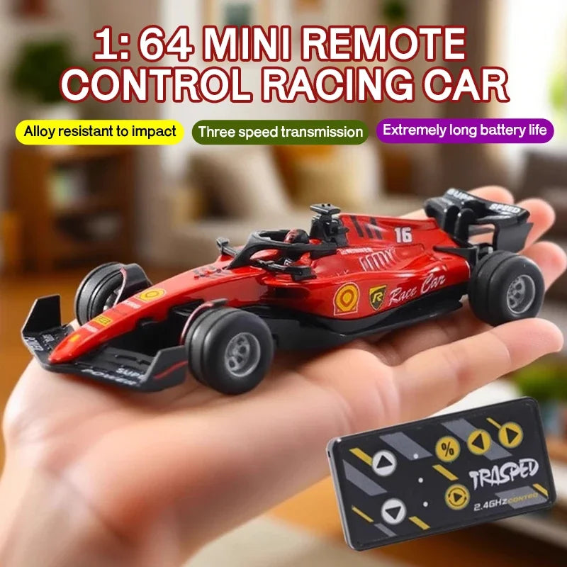 A red mini alloy remote control racing car is held in a hand, demonstrating its features.