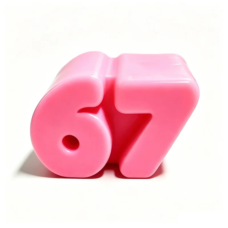 A pink squeeze stress relief toy shaped like the number 67, shown from a top-down angle.