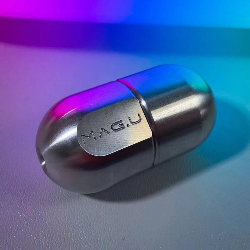 A silver magnetic levitating fidget slider toy resting on a light surface with colorful lighting.