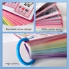 A stack of pink and green CVC word building cards with rounded corners and a blue ring binder.