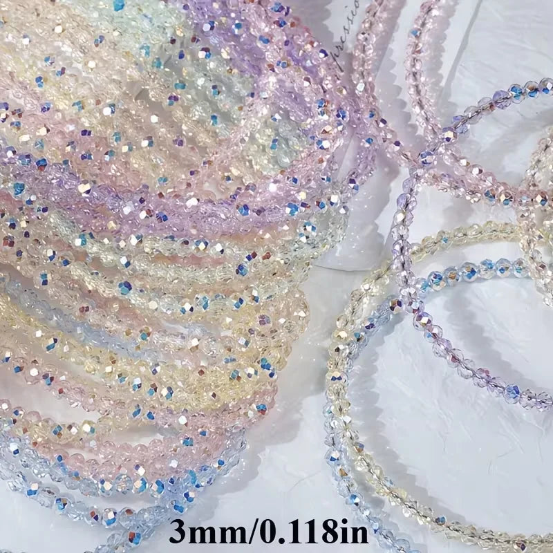 A collection of multicolor aurora cut glass beads in various shades of pink, purple, and clear are displayed for jewelry maki