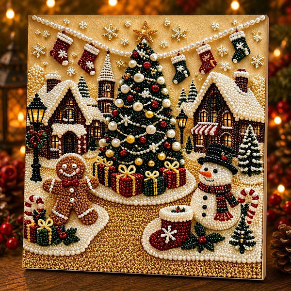 Et diamantmaleri med en festlig julescene med et pyntet træ, huse og sne under varme lys.