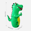 A bright green inflatable dinosaur punching bag for kids, shown in a side view.
