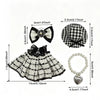 A plaid dress and accessory set featuring black and white checkered fabric, a bow, and a heart-shaped pendant.