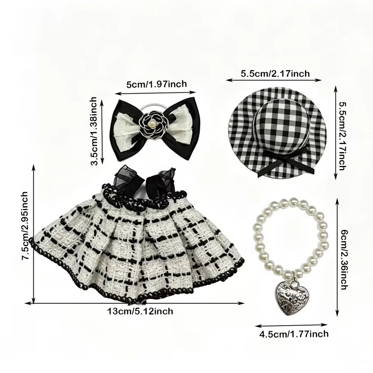 A plaid dress and accessory set featuring black and white checkered fabric, a bow, and a heart-shaped pendant.