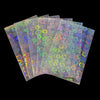 A stack of holographic card sleeves showing iridescent colors and floral patterns.