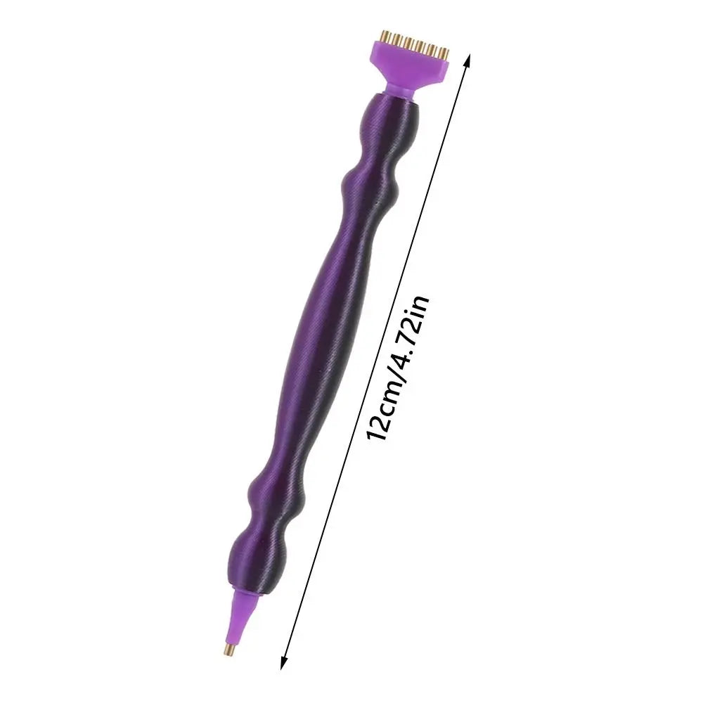 A purple precision diamond painting pen with replacement tips shown in a vertical view.
