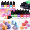 A collection of liquid colorants in various shades including purple, yellow, green, and pink for candle and soap making.