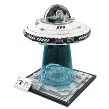 A model of an alien spaceship built from LEGO bricks, featuring a cockpit and a glass dome.