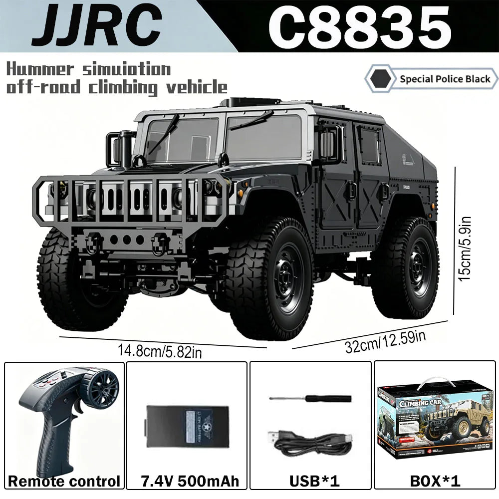 A black 1:12 scale RC off-road climbing vehicle with a remote control and accessories.