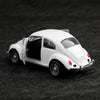 A white 1:38 die-cast model of a classic Beetle car shown from the side against a dark background.