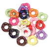 Assortment of colorful acrylic spacer beads in various shades including pink, purple, green, and orange.