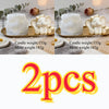 Two white elephant silicone molds shown with finished candles and molds for craft projects