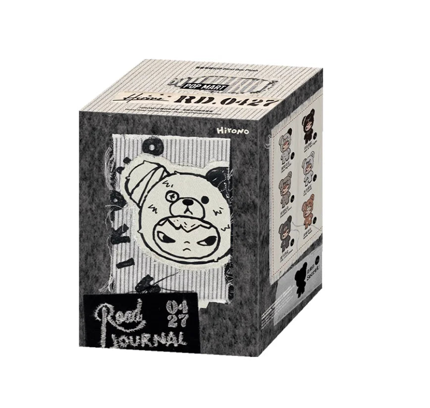 A box for a Hirono x Kodak Final Whistle plush doll pendant mystery collectible with a black and white design.