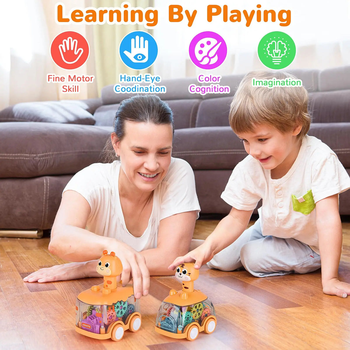 A mother and son play with orange and green light-up gear cars on a wooden floor.