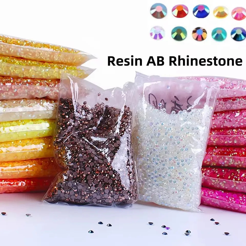 Bagged resin AB rhinestone glitter in various colors and sizes for crafting projects