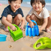 Three happy toddlers playing with green and blue dinosaur claw sand digging toys on a sandy beach.