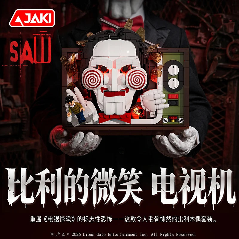 A detailed model building set of a horror movie puppet featuring a white mask and red accents, held by a person.
