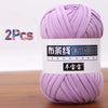 A skein of purple soft chunky t-shirt yarn for crochet and knitting, packaged as a 2-pack.