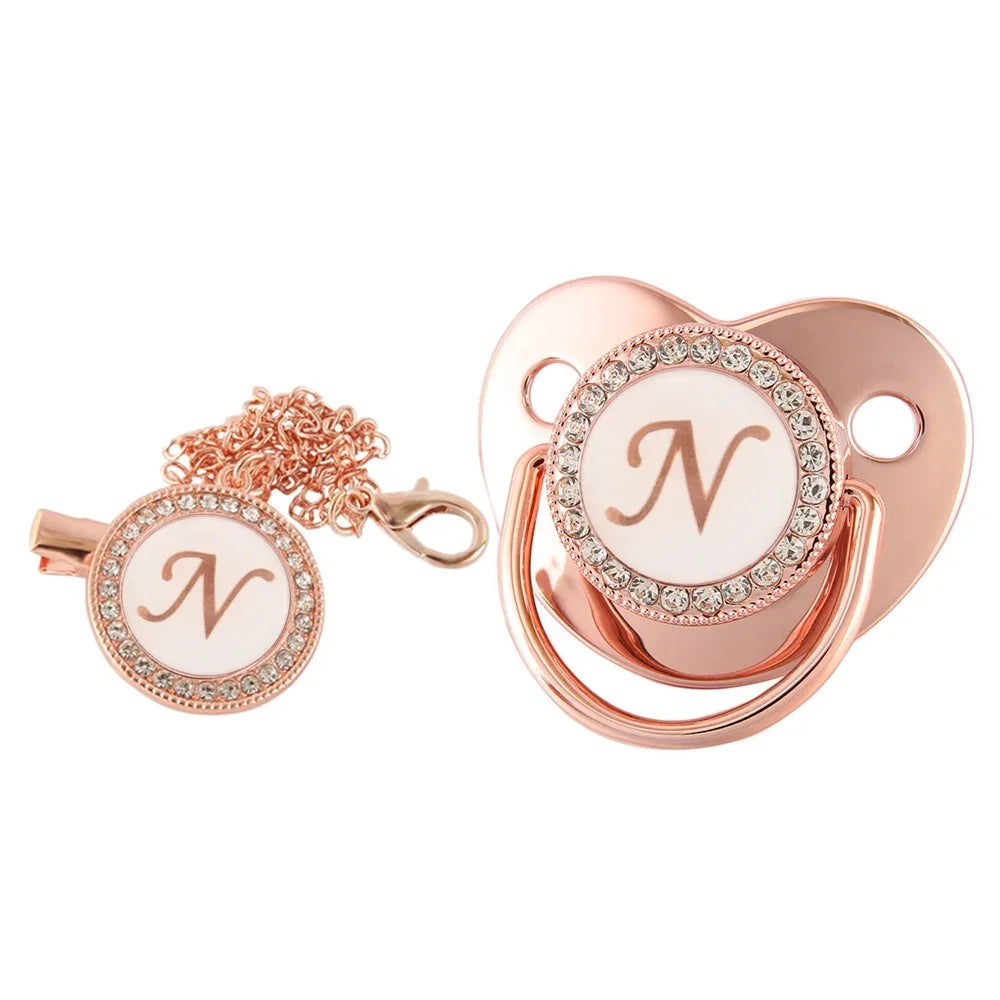 Rose gold bling baby pacifier clip with silicone holder featuring a letter N