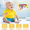 A baby is playing with a set of matching eggs for shape and color sorting activities.