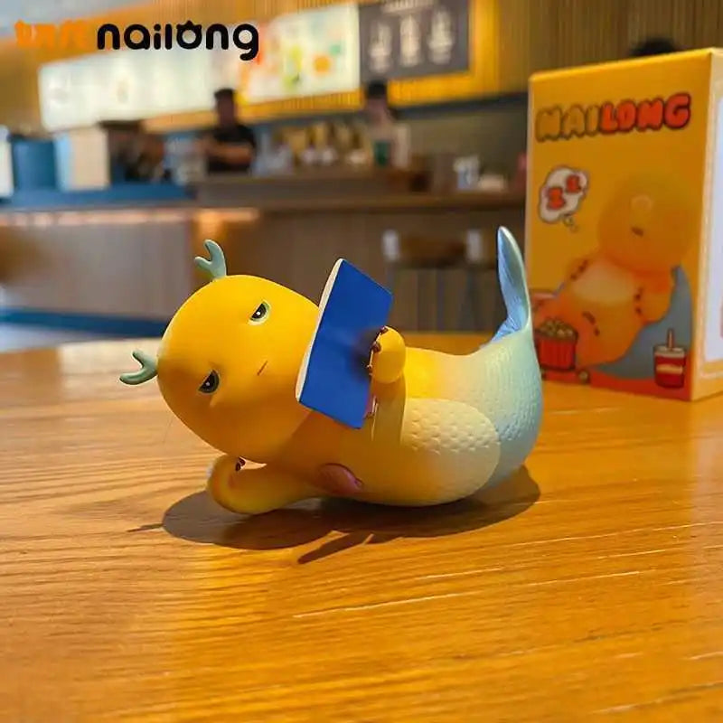 A yellow and light green decorative figurine of a dragon, possibly a blind box, sitting on a wooden table.