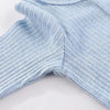 Light blue cotton baby bodysuit with long sleeves shown flat lay