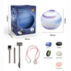 A box containing a planet gem digging kit with tools and various colored stones like agate obsidian and pink crystal.