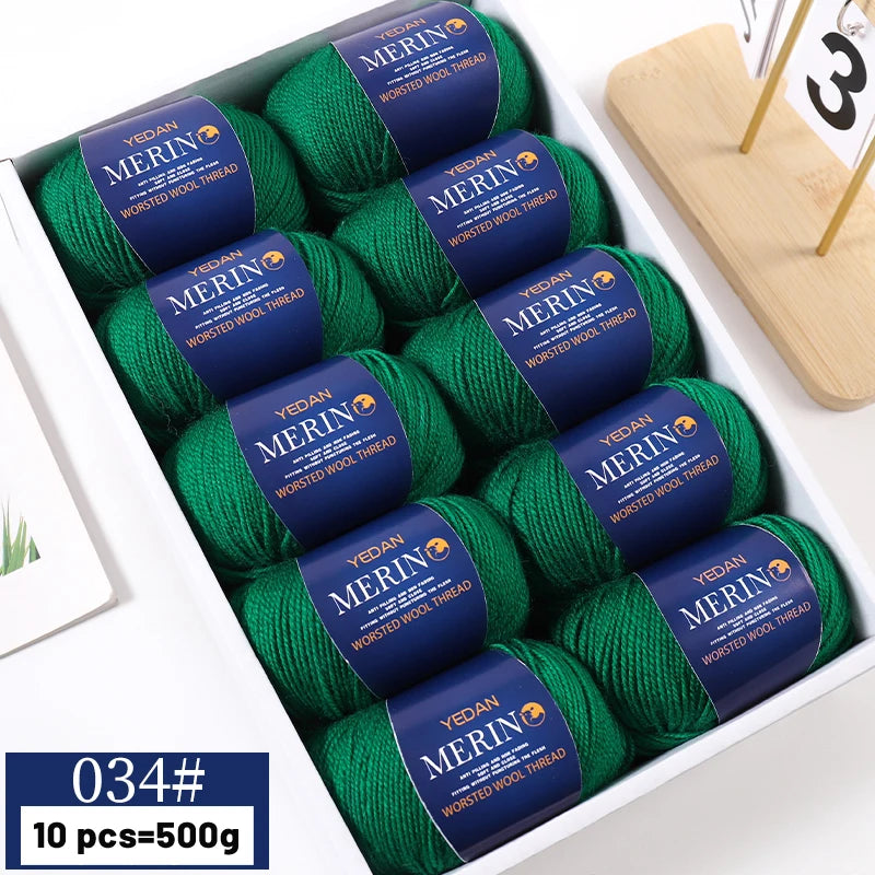 A box containing ten balls of bright green YEDAN MERIN worsted wool thread yarn for knitting projects.