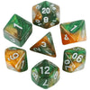 A set of polyhedral dice featuring a galaxy or cosmic effect with green and orange coloring.