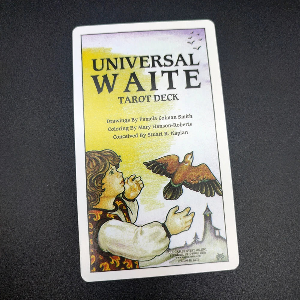 A deck of Universal Waite Tarot cards featuring drawings by Pamela Colman Smith and a guide book.