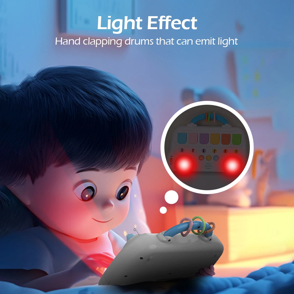 A child is interacting with a gray hand clapping drum toy that emits a light effect.