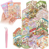 A hand holds an open book of DIY 3D sticker scenes and craft kits featuring colorful miniature buildings and landscapes.