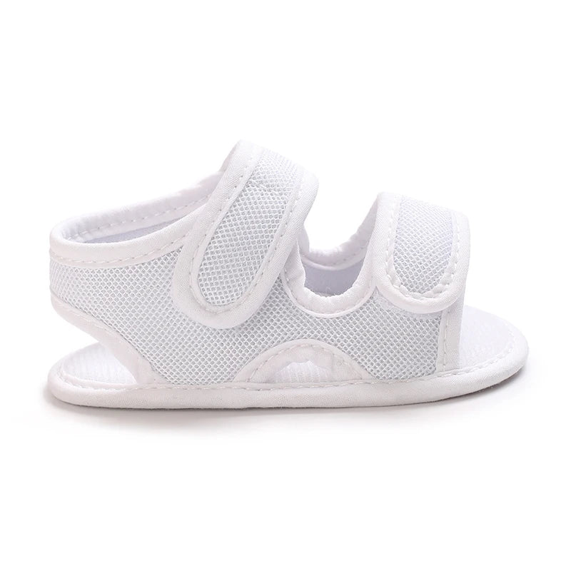 White breathable first walker sandals for baby with hook-and-loop closure and soft sole