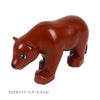 A brown plastic zoo animal building block set featuring a lion or bear figure.