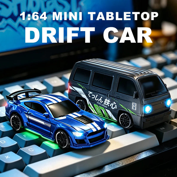 A blue drift car model is displayed on a keyboard, next to a larger black version.