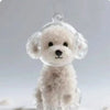 A clear resin dog-shaped pet hair keepsake keychain with soft white fur texture.