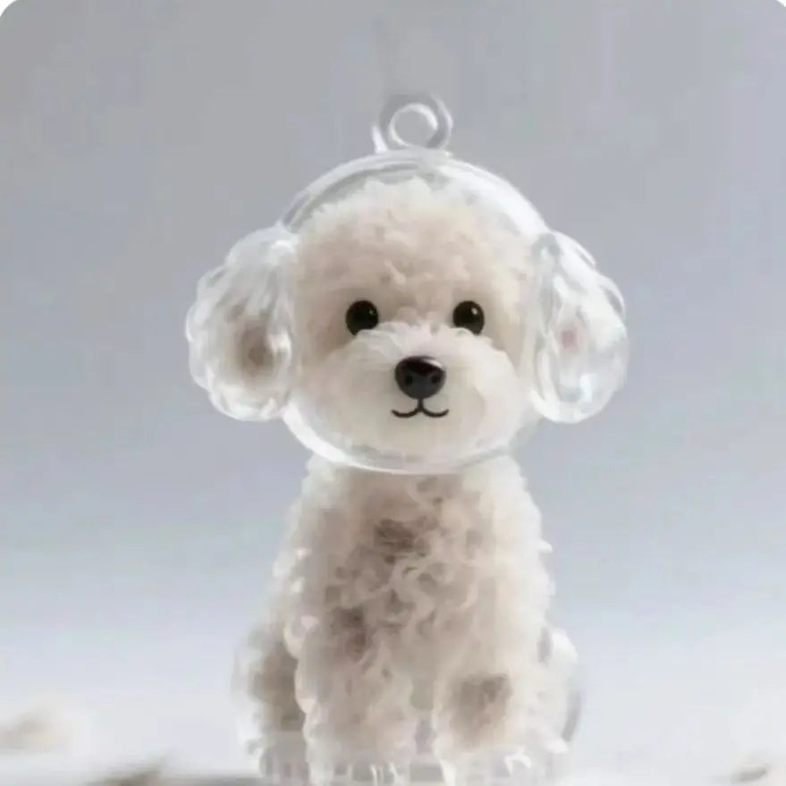 A clear resin dog-shaped pet hair keepsake keychain with soft white fur texture.