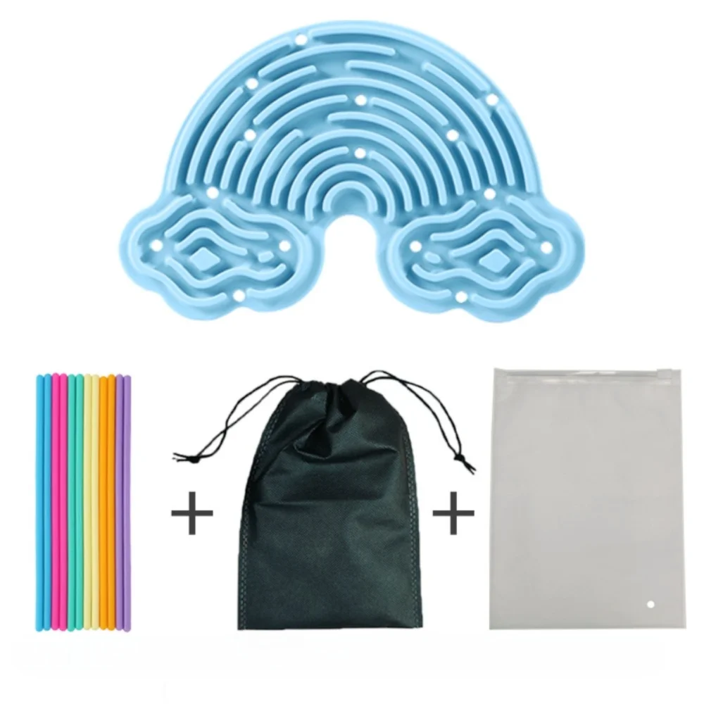 Light blue silicone sensory activity board with concentric grooves and a dark green drawstring bag and a white pouch