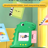 A green dinosaur-shaped learning machine for preschool preparation with a screen and cards.