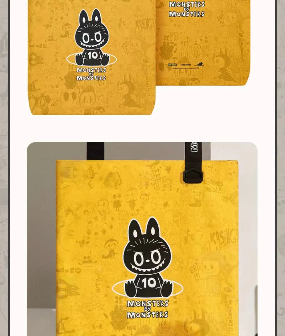A yellow paper bag featuring a black cartoon monster face and the text Monsters by Monsters.