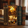 A wooden book nook kit featuring miniature figurines and detailed scenes inside carved wooden books.