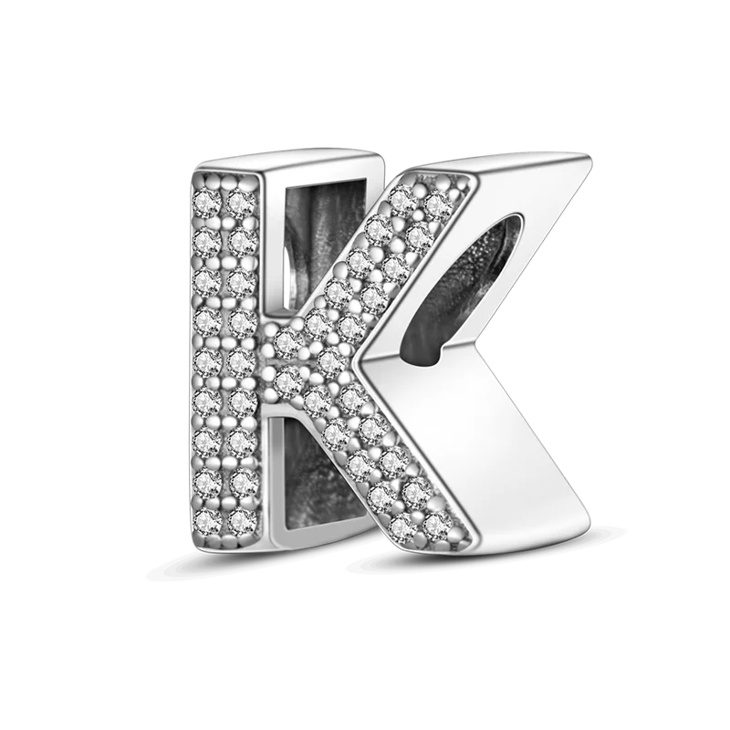 A sterling silver alphabet charm shaped like the letter K, encrusted with cubic zirconia stones.