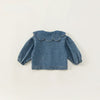 A denim jacket for kids featuring a ruffled collar and gathered sleeves.