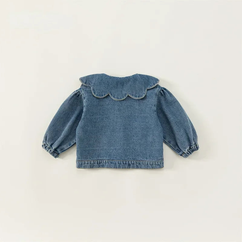 A denim jacket for kids featuring a ruffled collar and gathered sleeves.