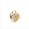Gold charm bracelet featuring elephant, key, butterfly, and heart pendants.