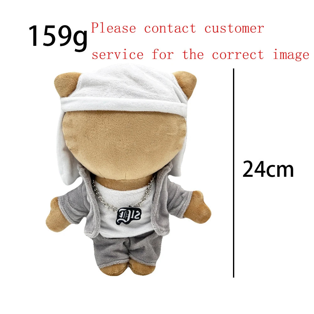 A plush doll resembling Eminem, XXXTentacion, and Frank Ocean wearing a white hat and gray clothing.