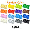 Collection de blocs de construction de différentes couleurs comme le jaune, le vert, l'orange, le violet, le bleu, le rose et