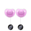 A pair of pink silicone pacifiers with protective covers shown alongside the silicone soothers.